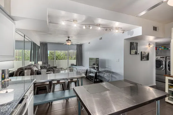 a view of a dining room with furniture window and outside view