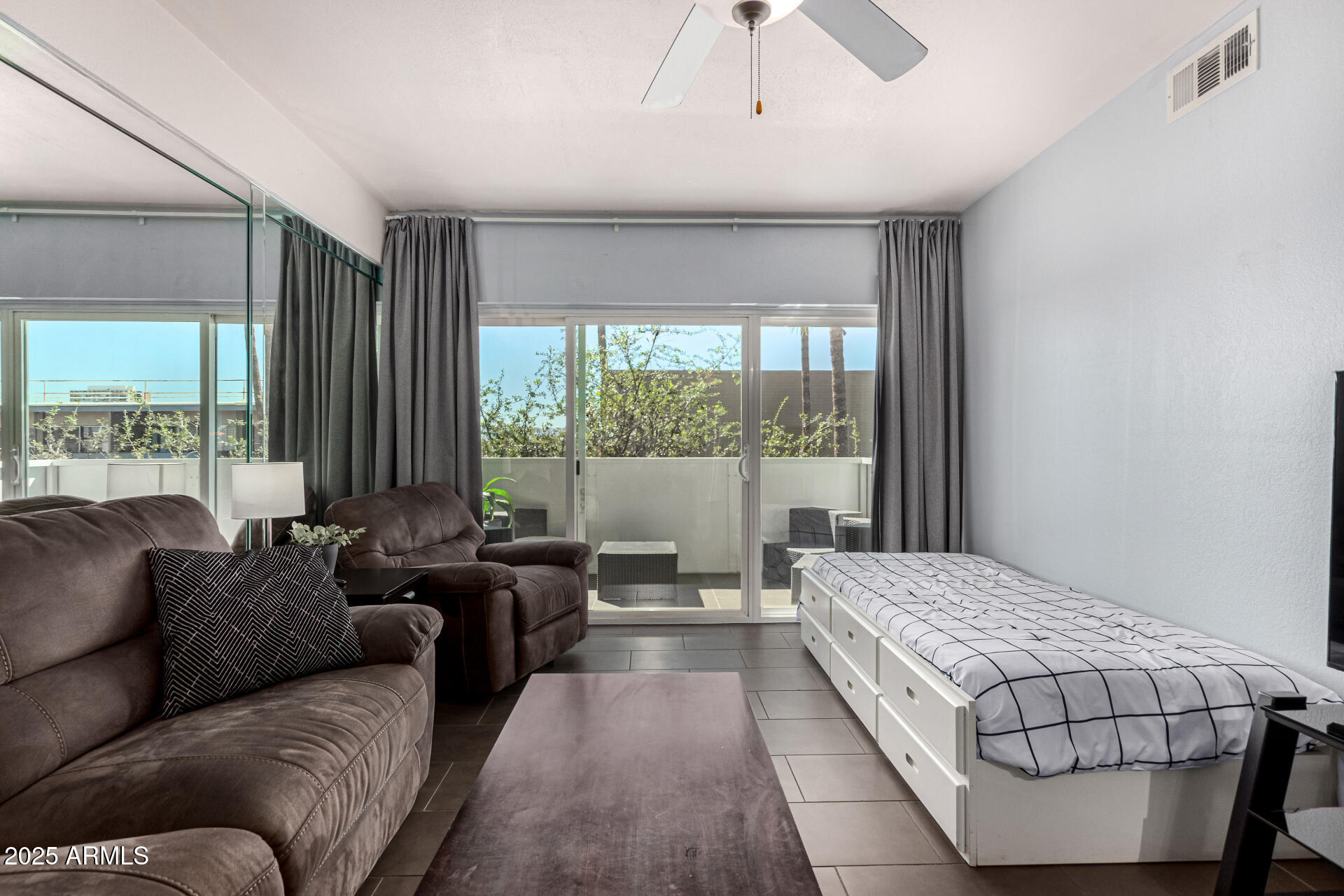 351 East Thomas Road, Unit D505 Phoenix, AZ 85004 - Photo 10 of 28 a living room with furniture and a large window