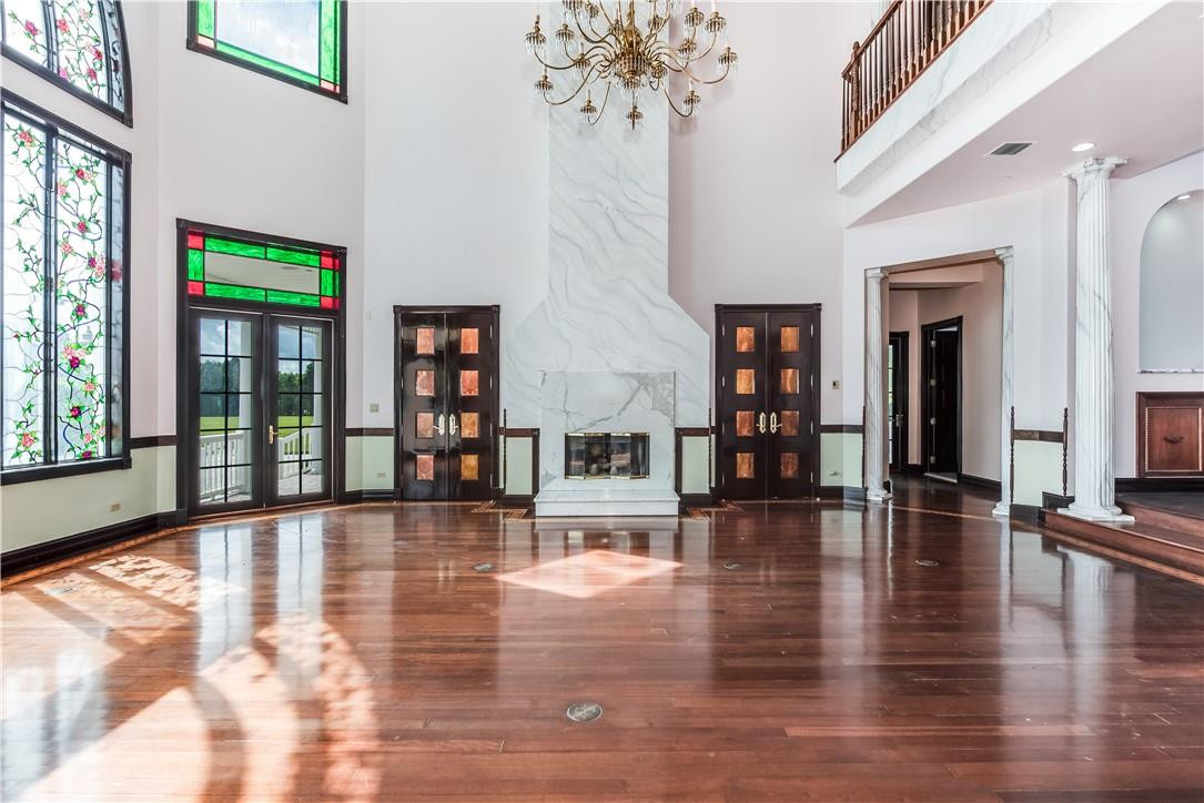5550 Hancock Road Southwest Ranches, FL 33330 - Photo 24 of 60 a view of an entryway with wooden floor and a fireplace