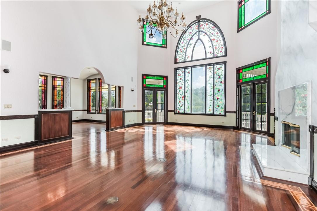 5550 Hancock Road Southwest Ranches, FL 33330 - Photo 25 of 60 a view of an entryway with wooden floor and a floor to ceiling window