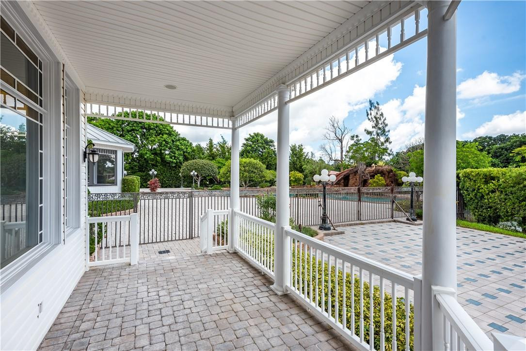 5550 Hancock Road Southwest Ranches, FL 33330 - Photo 52 of 60 a view of a porch with wooden floor of the house