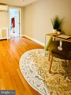 a bedroom with a bed and a ceiling fan