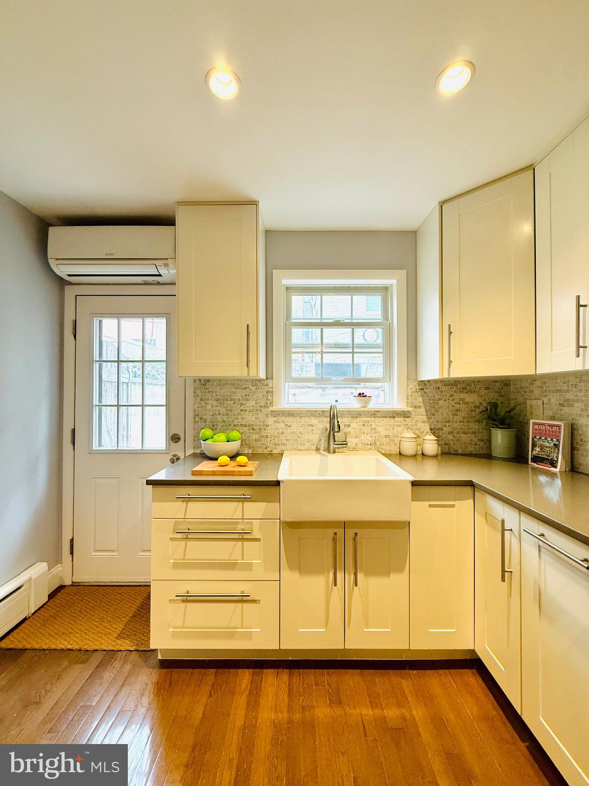 619 Sears Street Philadelphia, PA 19147 - Photo 8 of 23 a view of a kitchen with a sink and wooden floor