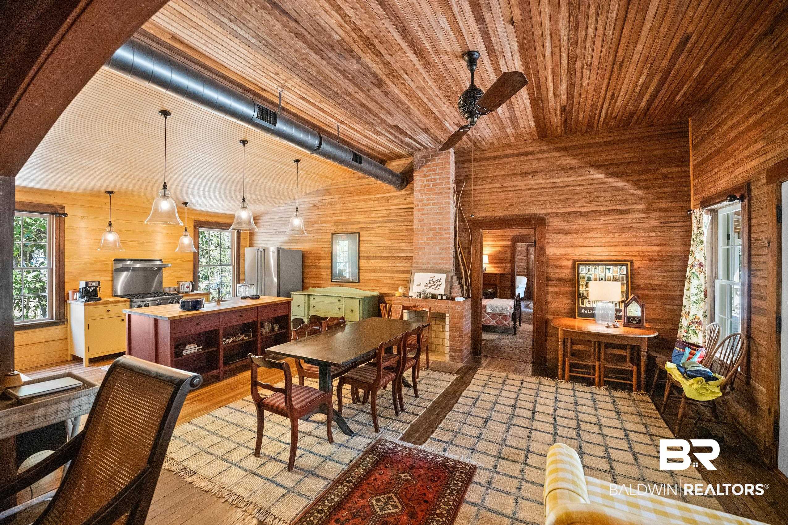 30671 Magnolia Street Elberta, AL 36530 - Photo 17 of 68 Dining space with wooden walls, wood finished floors, wooden ceiling, and a healthy amount of sunlight