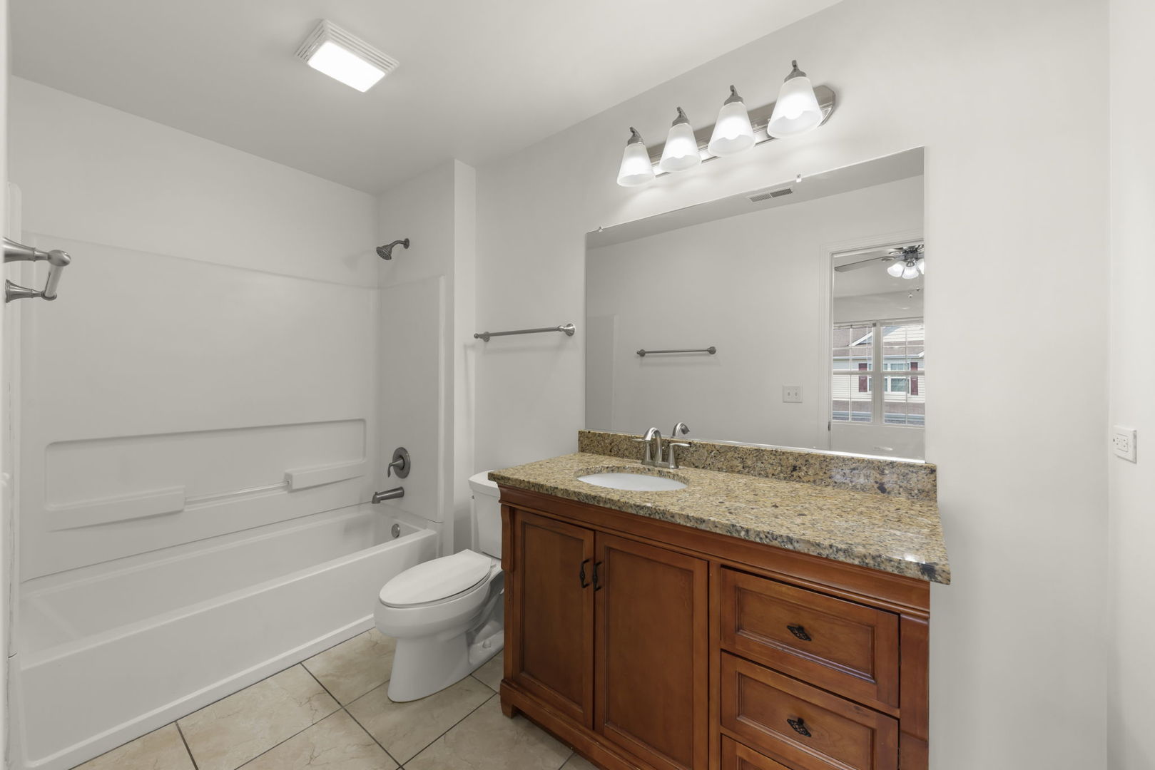 1034 Turin Drive Hampshire, IL 60140 - Photo 14 of 23 a bathroom with a granite countertop sink a toilet and bathtub