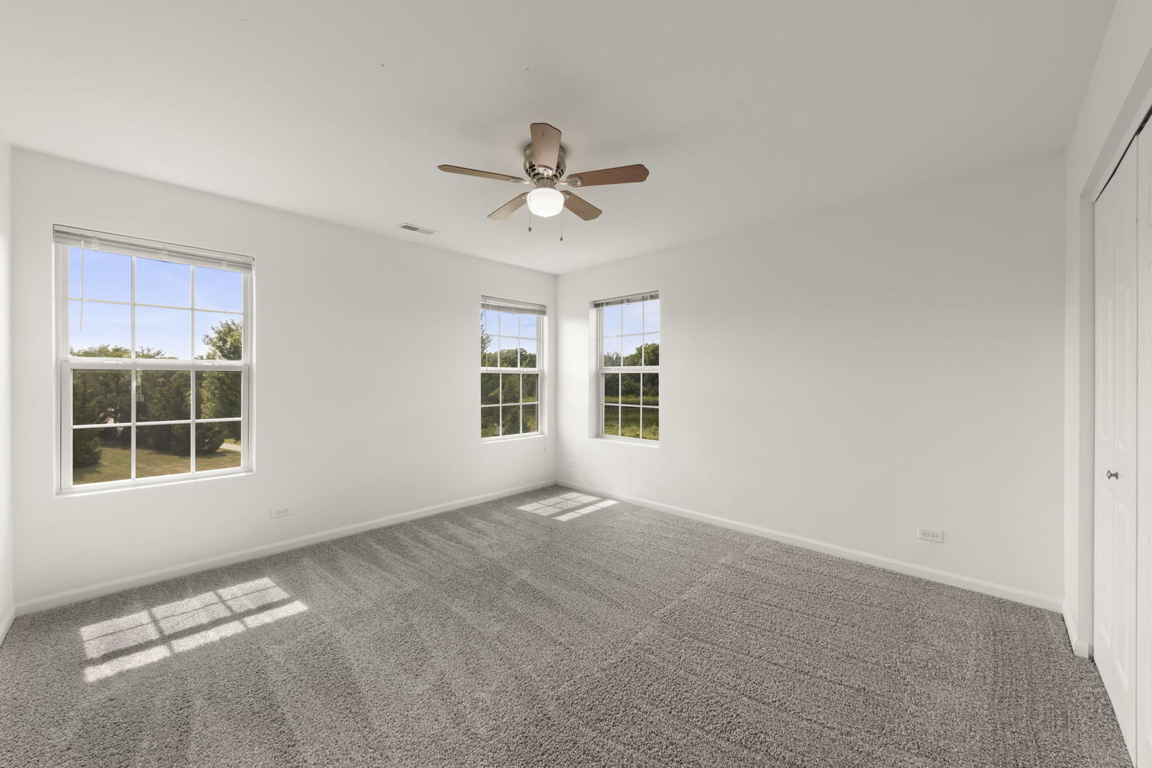 1034 Turin Drive Hampshire, IL 60140 - Photo 15 of 23 a view of a livingroom with a ceiling fan and window