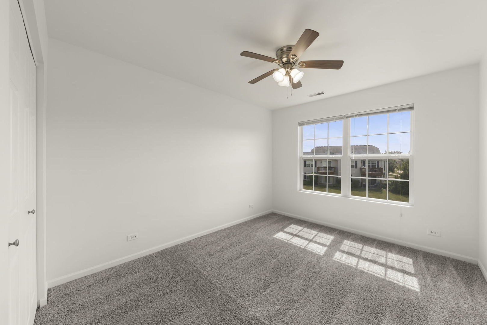 1034 Turin Drive Hampshire, IL 60140 - Photo 16 of 23 a view of empty room with wooden floor and fan