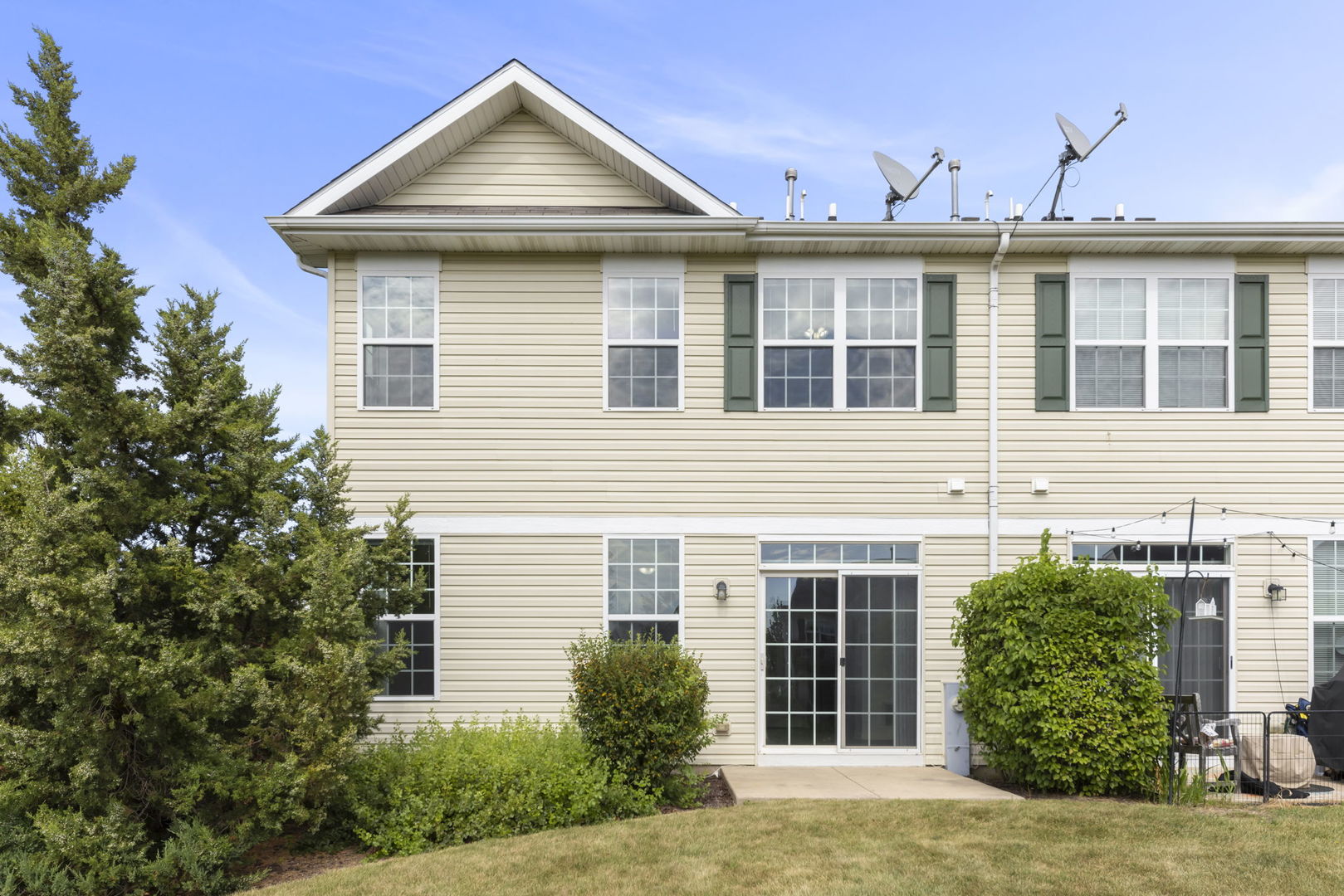 1034 Turin Drive Hampshire, IL 60140 - Photo 21 of 23 a view of a house with a yard and potted plants