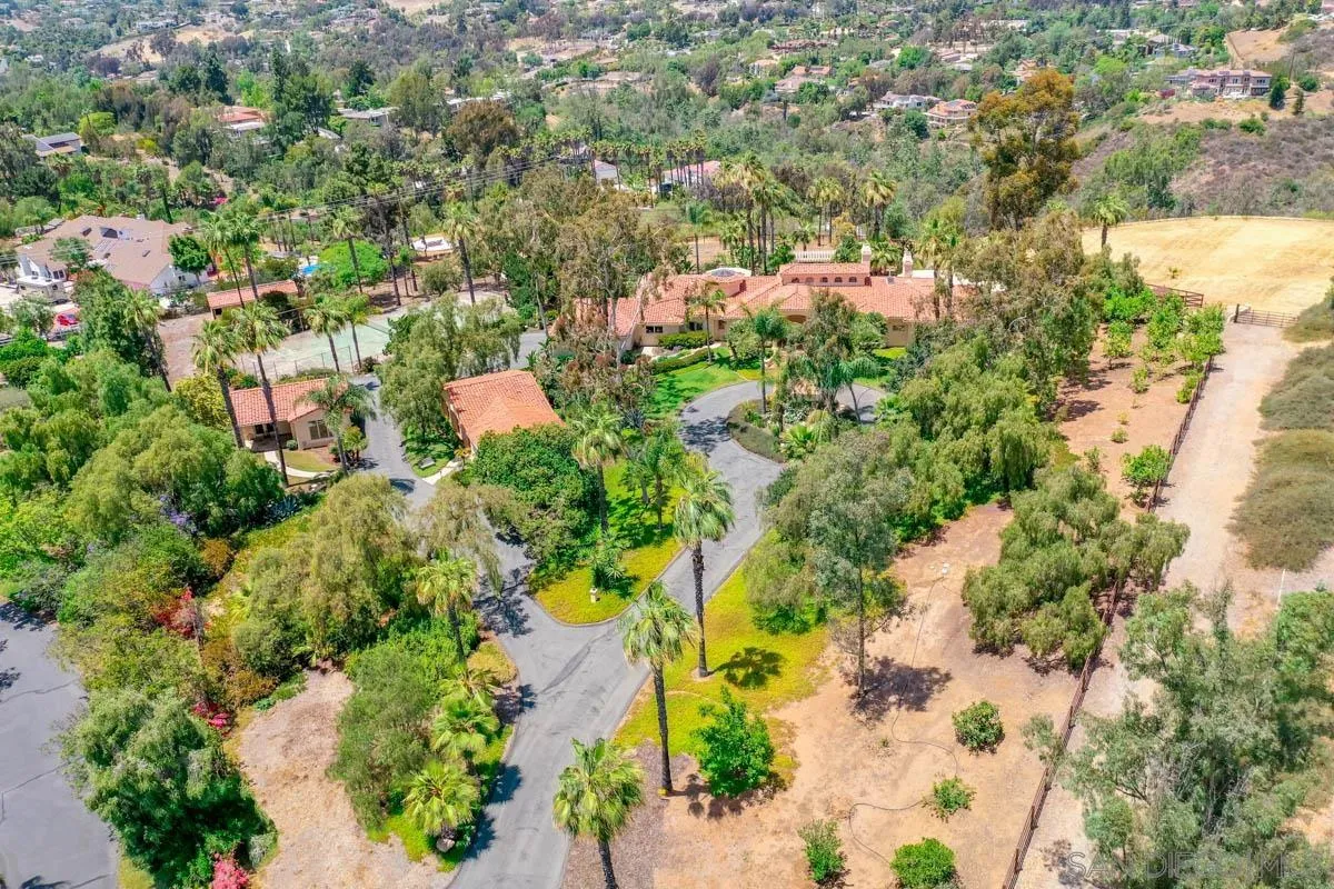an aerial view of a houses with yard