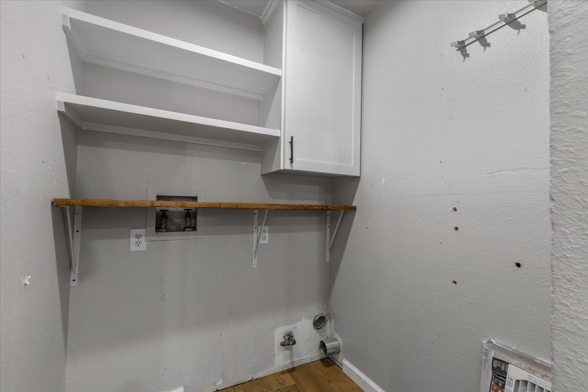 6200 Shadow Bend Austin, TX 78745 - Photo 13 of 33 Functional utility space with convenient shelving and cabinetry.