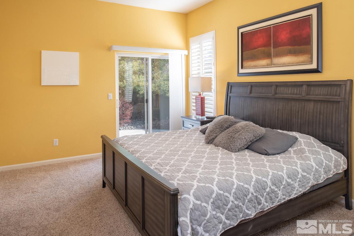 1725 Colavita Way Reno, NV 89521 - Photo 11 of 22 a bedroom with a bed and a painting on the wall