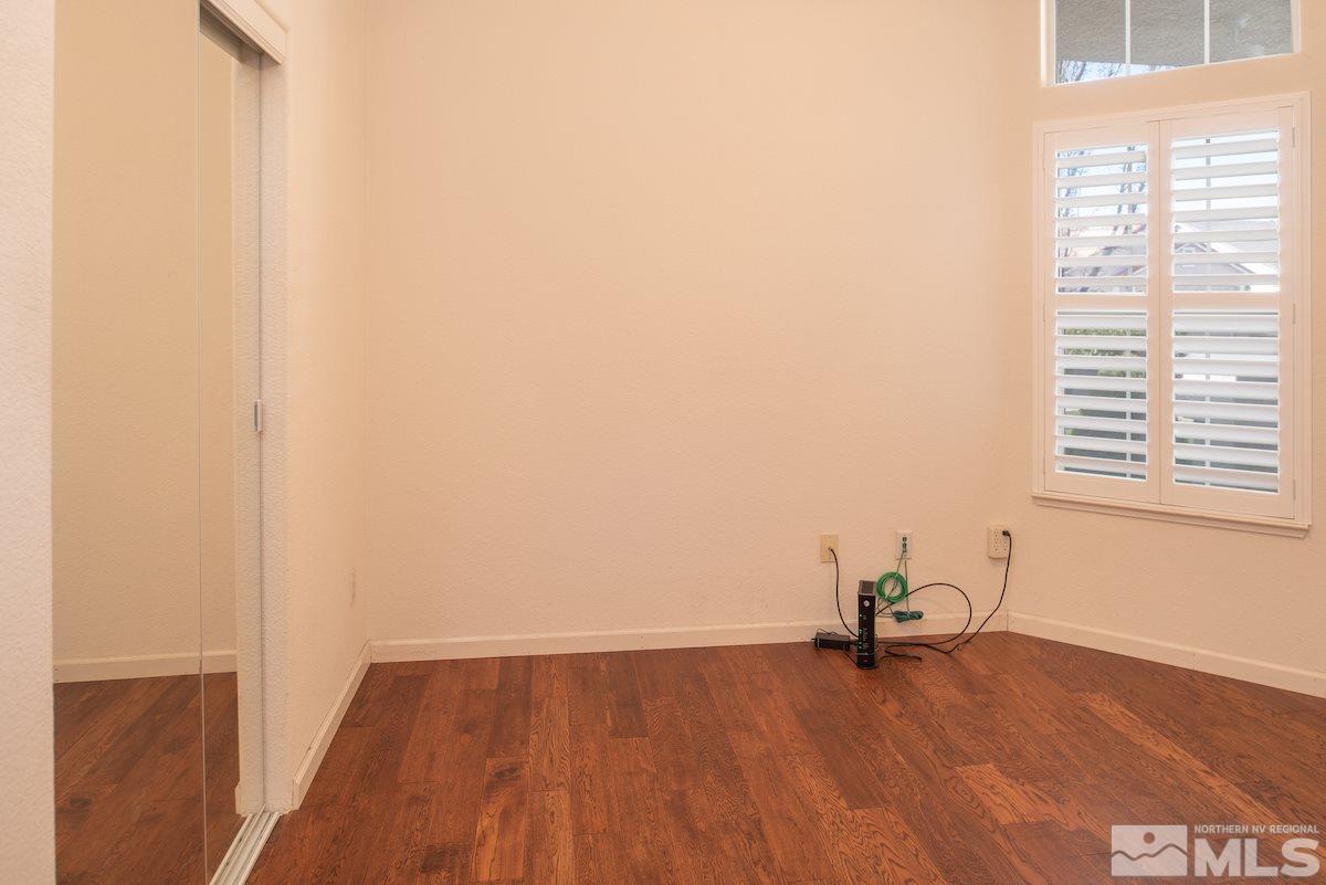 1725 Colavita Way Reno, NV 89521 - Photo 17 of 22 a view of a livingroom with wooden floor and a window
