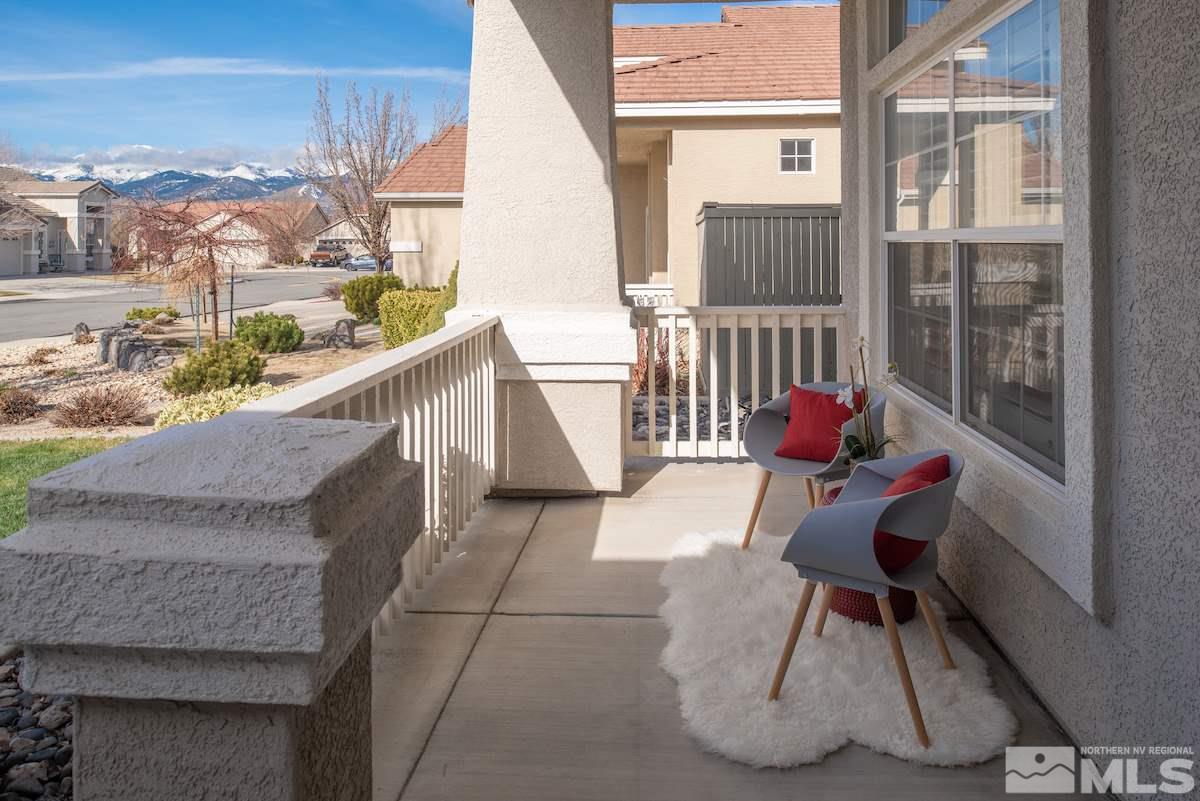 1725 Colavita Way Reno, NV 89521 - Photo 19 of 22 a view of balcony with two chairs and a large window