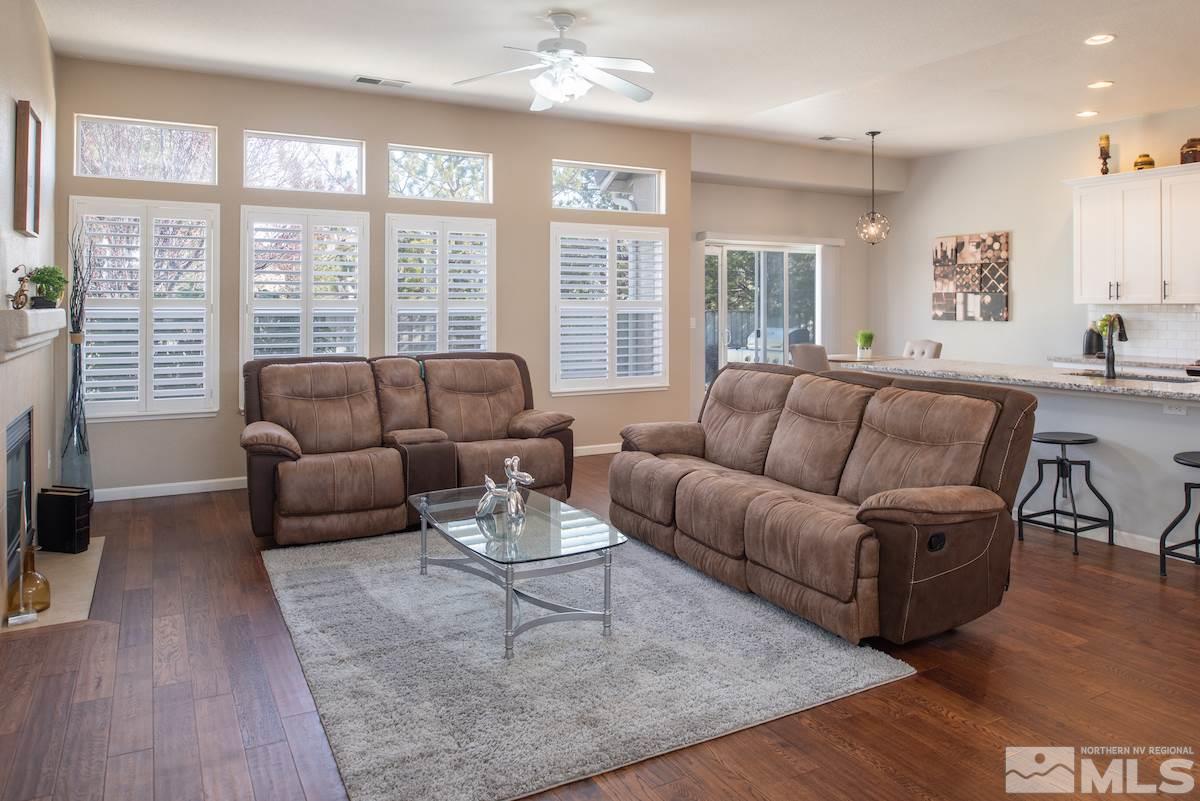 1725 Colavita Way Reno, NV 89521 - Photo 2 of 22 a living room with furniture wooden floor and a large window