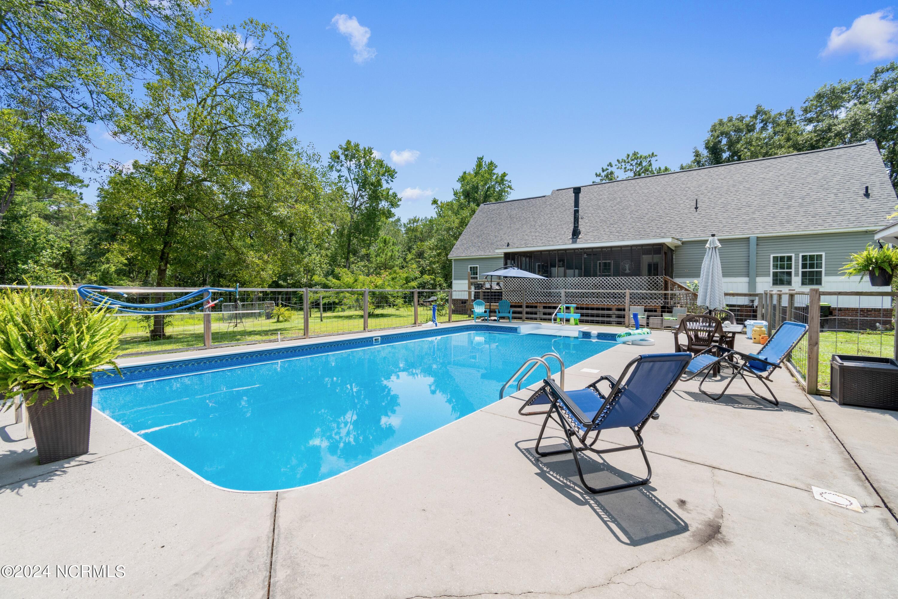 1736 Maco Road Northeast Leland, NC 28451 - Photo 41 of 52 Fenced in Pool Area