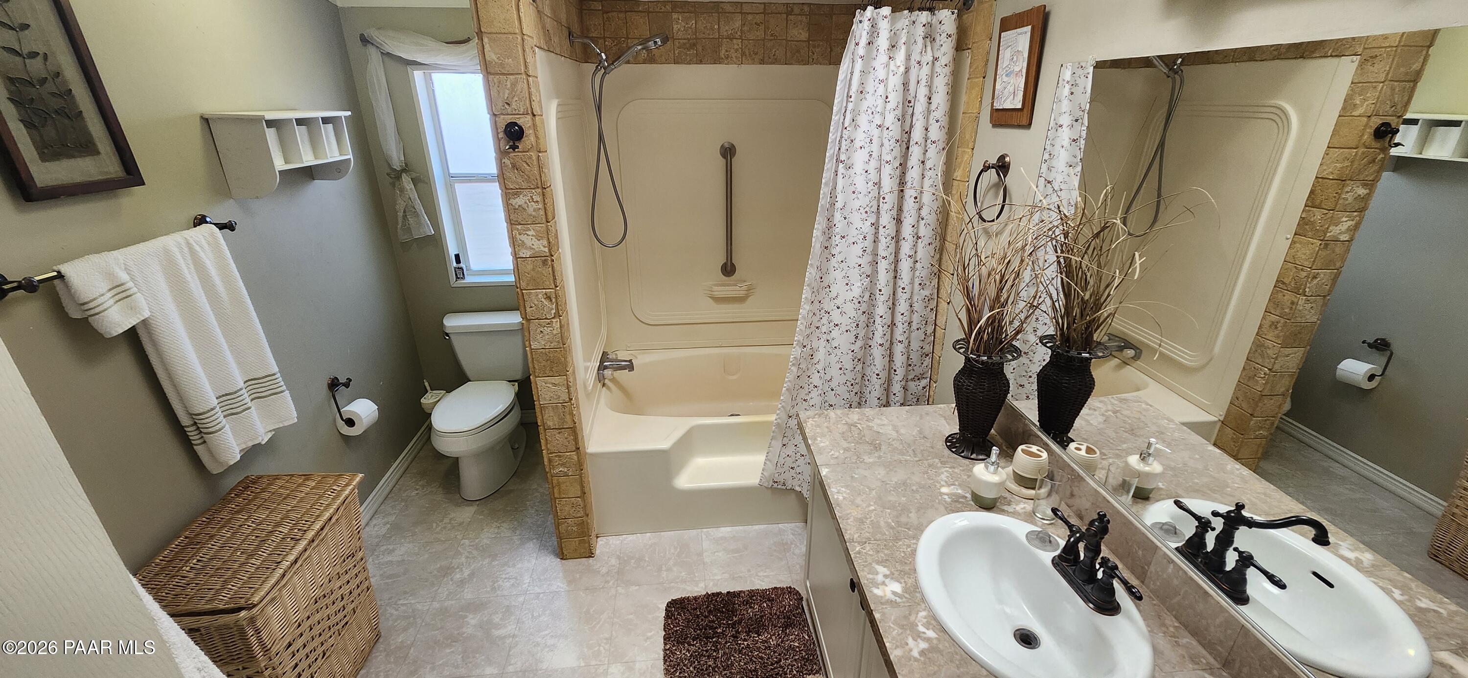 2373 Roberts Road Ash Fork, AZ 86320 - Photo 12 of 41 a bathroom with a sink toilet and shower