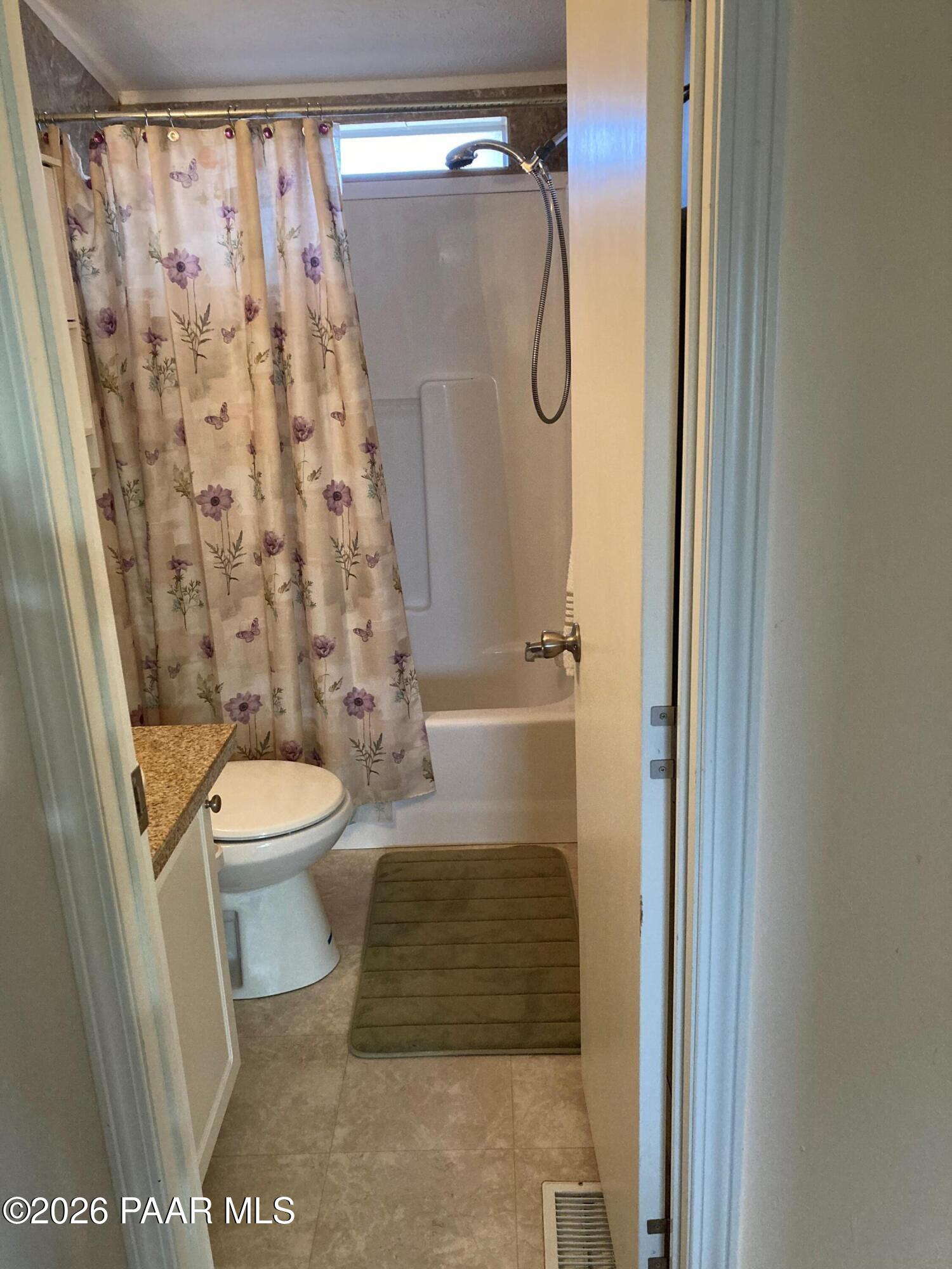 2373 Roberts Road Ash Fork, AZ 86320 - Photo 15 of 41 a bathroom with a toilet and shower