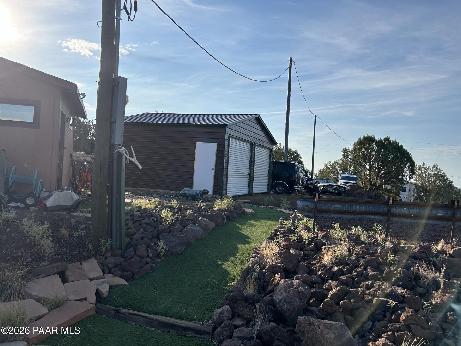 2373 Roberts Road Ash Fork, AZ 86320 - Photo 32 of 41 a front view of a house with a yard