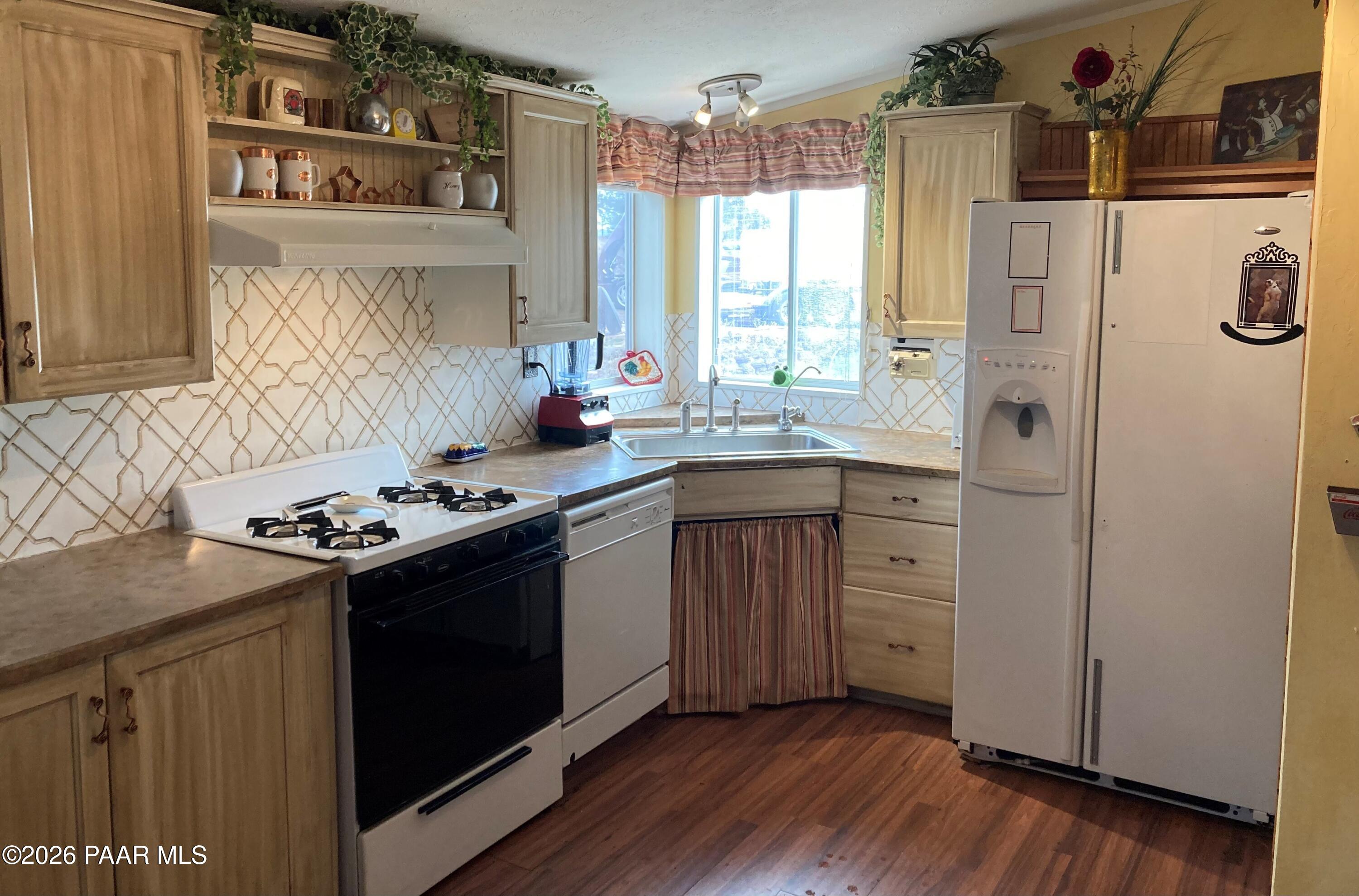 2373 Roberts Road Ash Fork, AZ 86320 - Photo 6 of 41 a kitchen with a sink stove and refrigerator