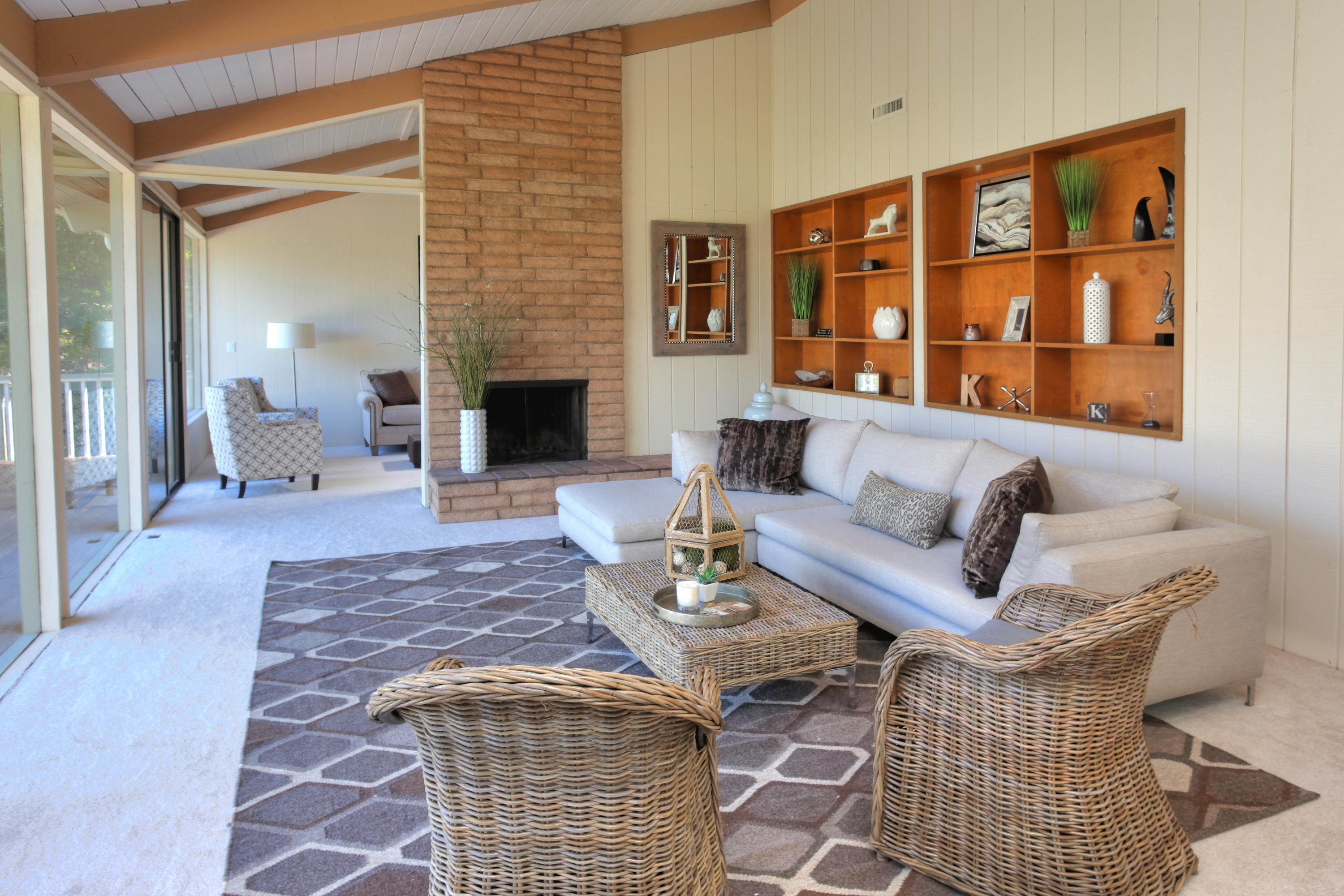 1202 Las Alturas Road Santa Barbara, CA 93103 - Photo 5 of 17 a living room with furniture a fireplace and a table