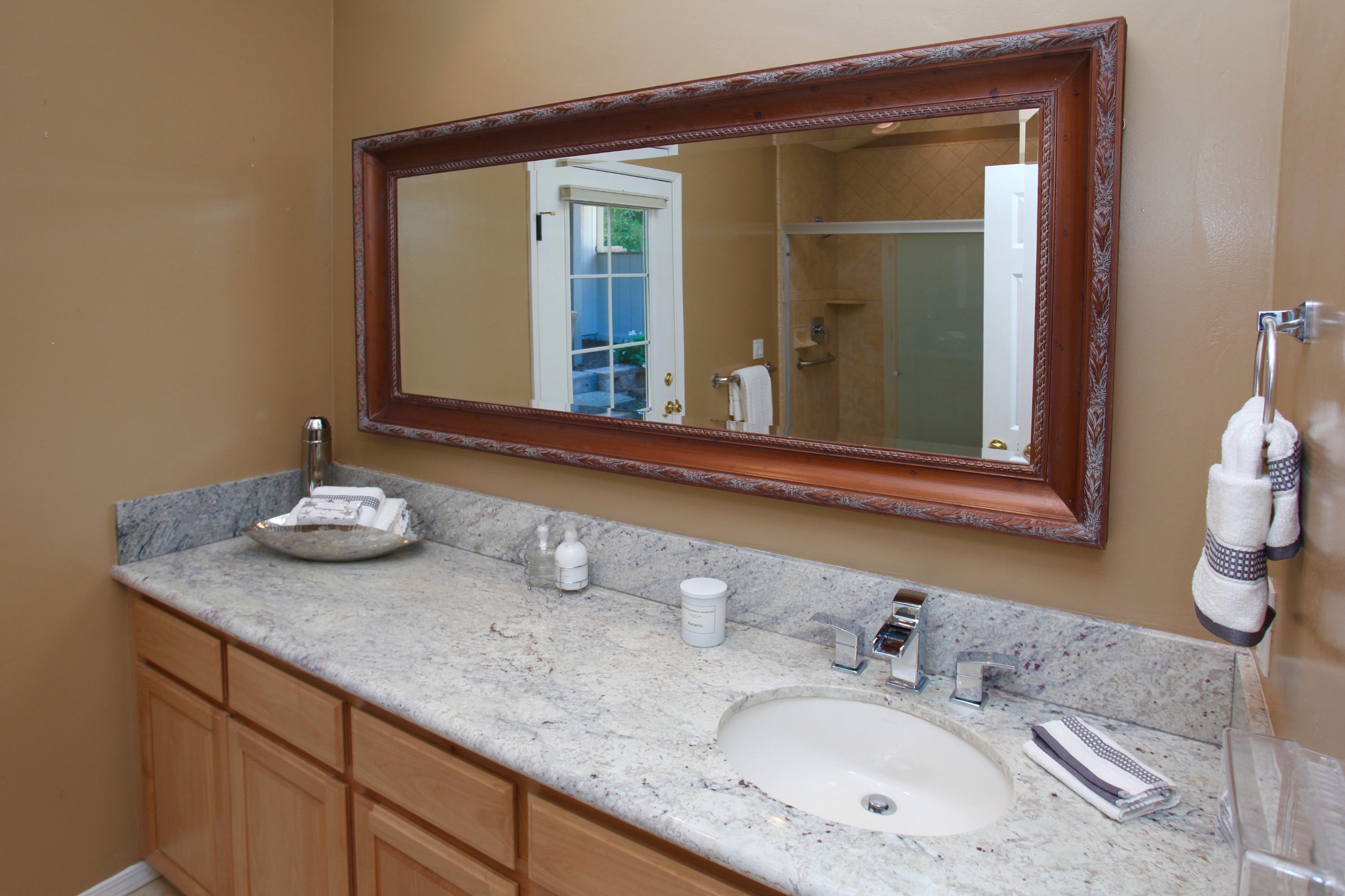 1202 Las Alturas Road Santa Barbara, CA 93103 - Photo 10 of 17 a bathroom with a granite countertop sink and a mirror