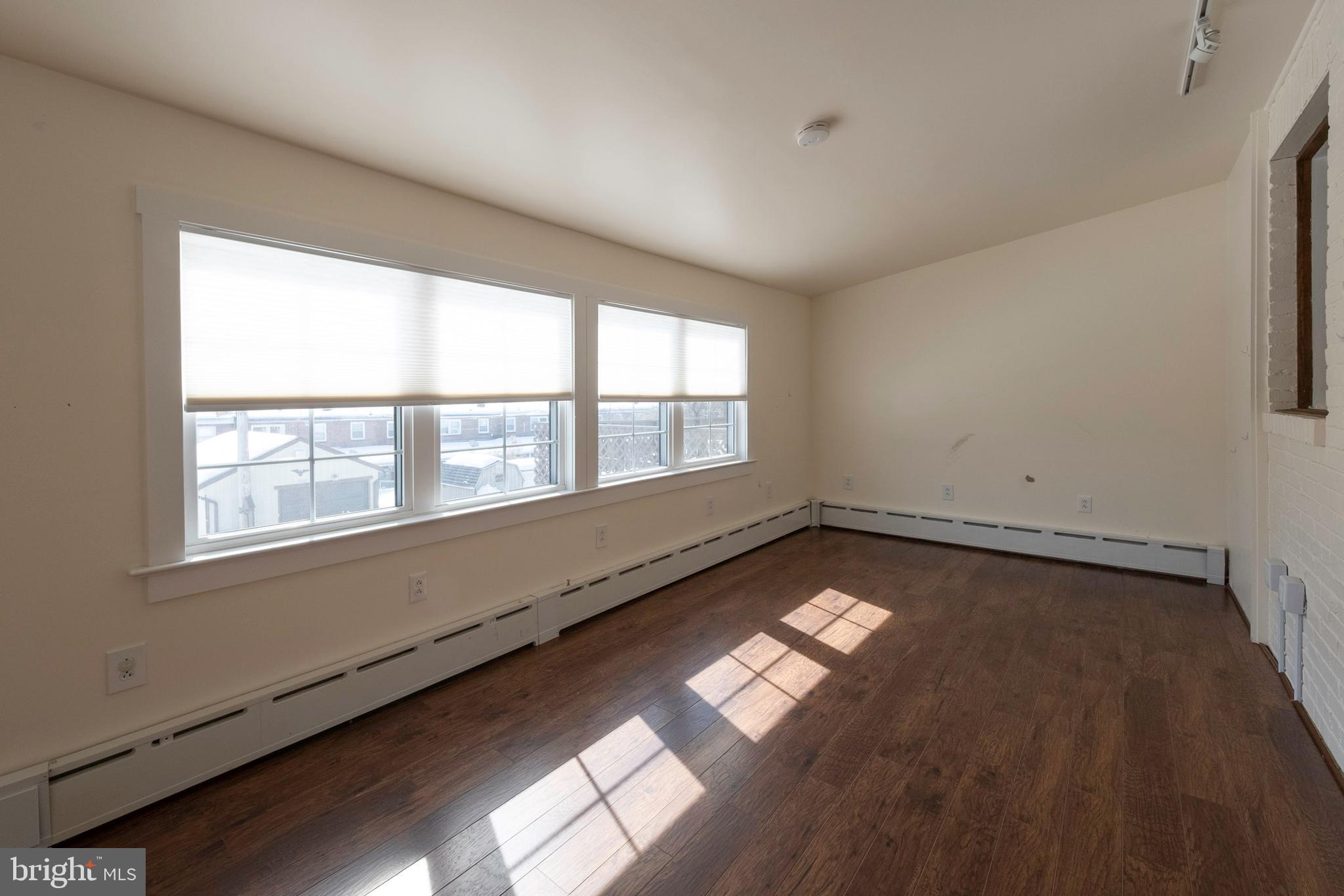 333 Sunset Road Reading, PA 19611 - Photo 5 of 17 a view of an empty room with a window