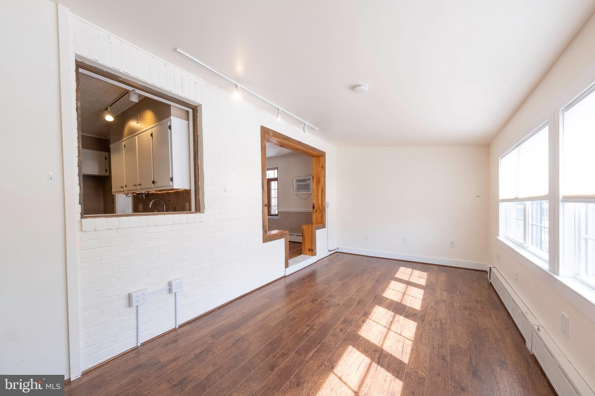 333 Sunset Road Reading, PA 19611 - Photo 7 of 17 a view of empty room with wooden floor and fan