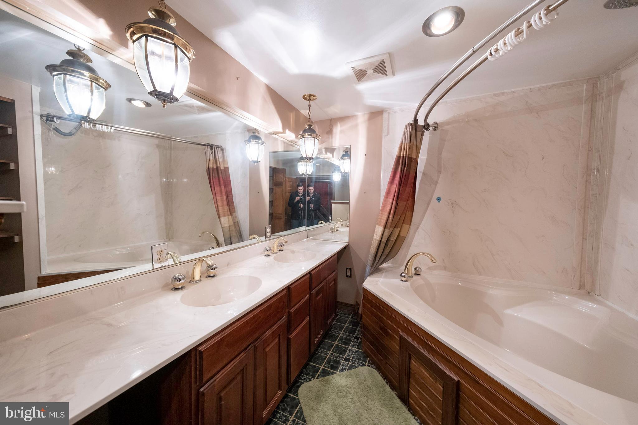333 Sunset Road Reading, PA 19611 - Photo 10 of 17 a bathroom with a double vanity sink and a mirror