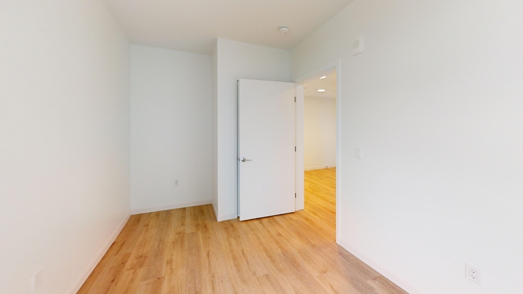 60 Kilmarnock Street, Unit 842 Boston, MA 02215 - Photo 11 of 13 a view of a room with wooden floor and a hallway