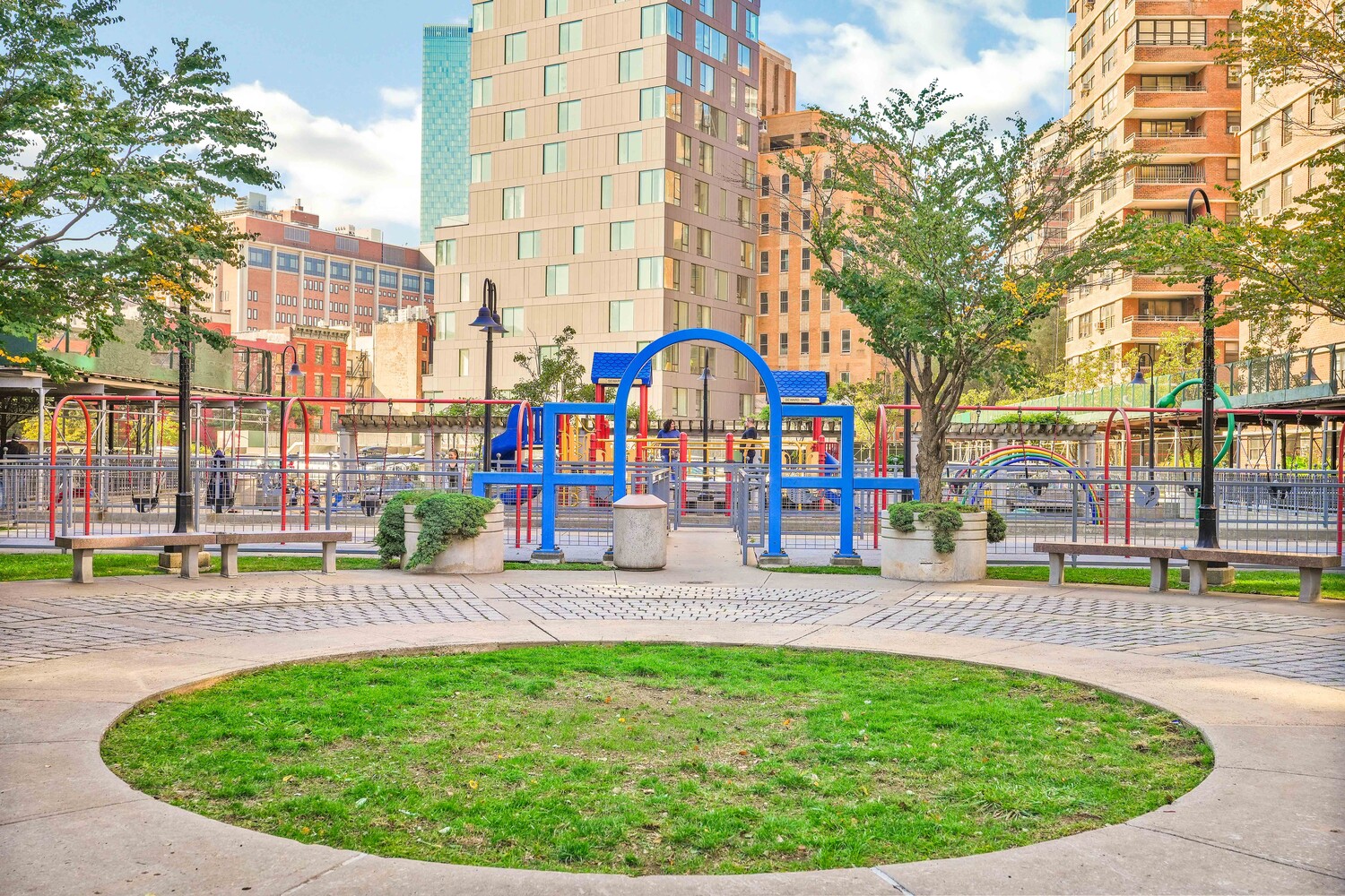 268 East Broadway, Unit A1706 Manhattan, NY 10002 - Photo 11 of 39 an outdoor space with lots of swings and slides