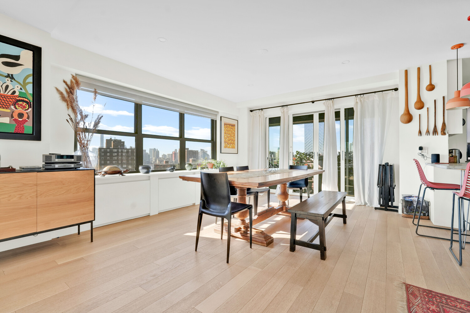 268 East Broadway, Unit A1706 Manhattan, NY 10002 - Photo 35 of 39 a dining room with furniture and wooden floor