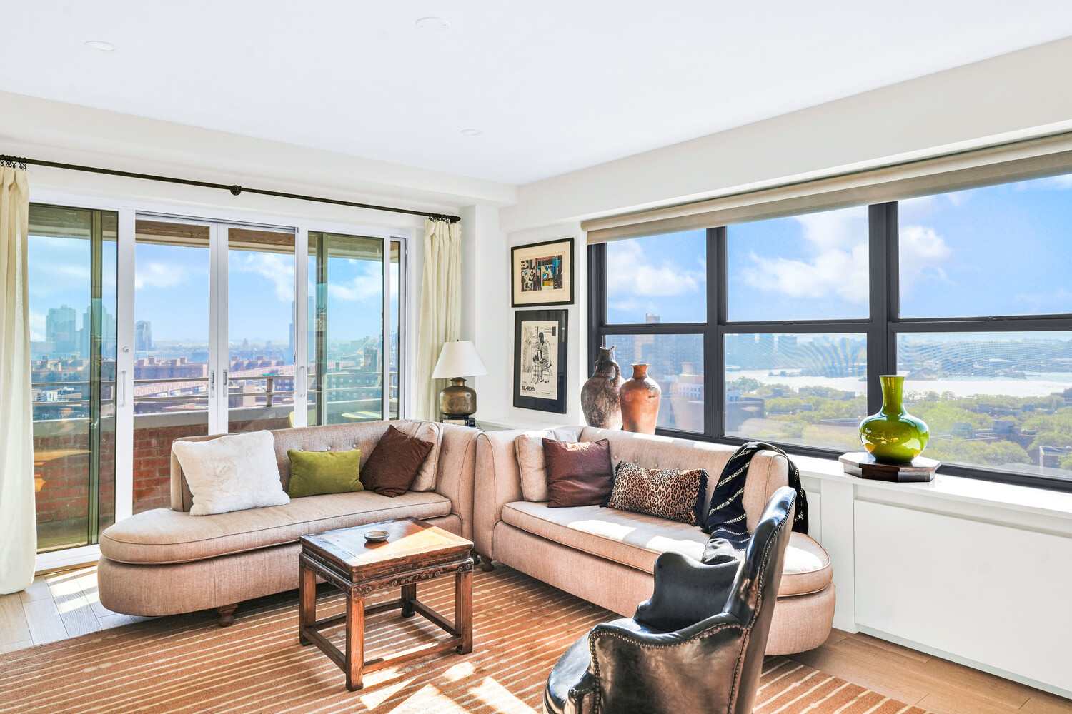 268 East Broadway, Unit A1706 Manhattan, NY 10002 - Photo 36 of 39 a living room with furniture and a large window