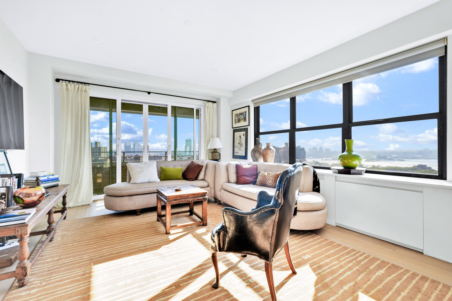 268 East Broadway, Unit A1706 Manhattan, NY 10002 - Photo 37 of 39 a living room with furniture and a large window