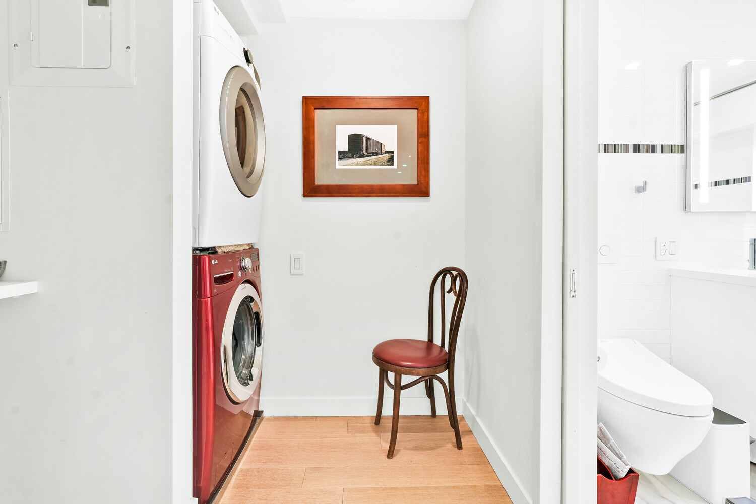 268 East Broadway, Unit A1706 Manhattan, NY 10002 - Photo 4 of 39 a view of a hallway with washer and dryer