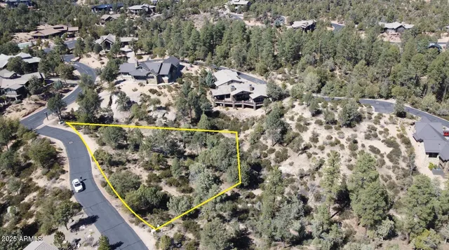 an aerial view of house with yard