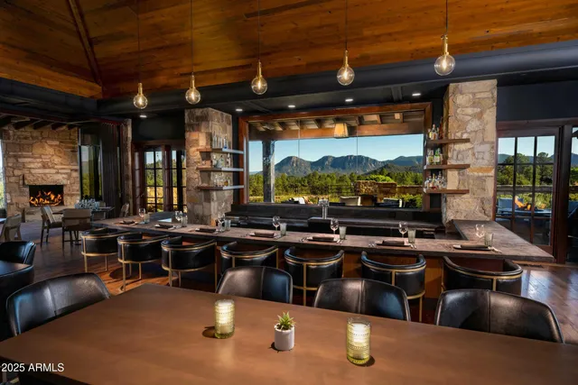 a kitchen with stainless steel appliances granite countertop a stove and a view of the kitchen