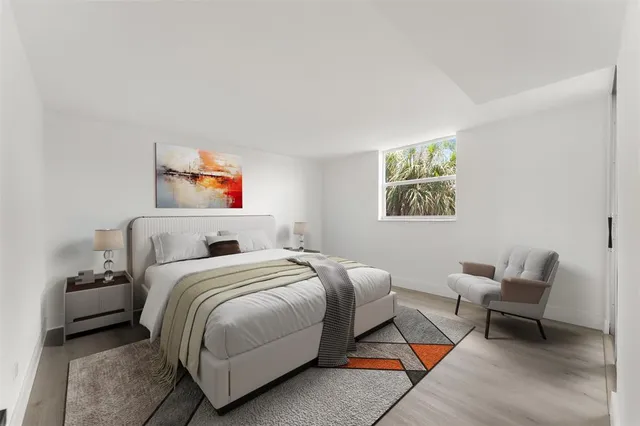 a bedroom with a bed and a couch