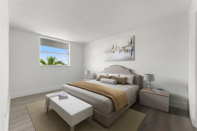 a bedroom with bed and a window