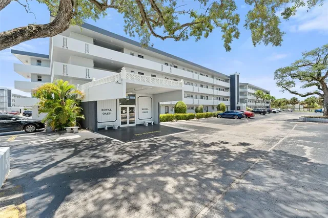 a view of a swimming pool with a yard and lake view