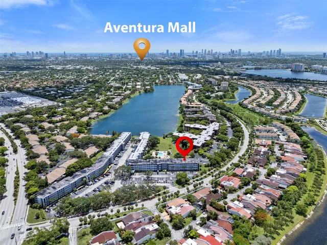 an aerial view of a residential houses with outdoor space