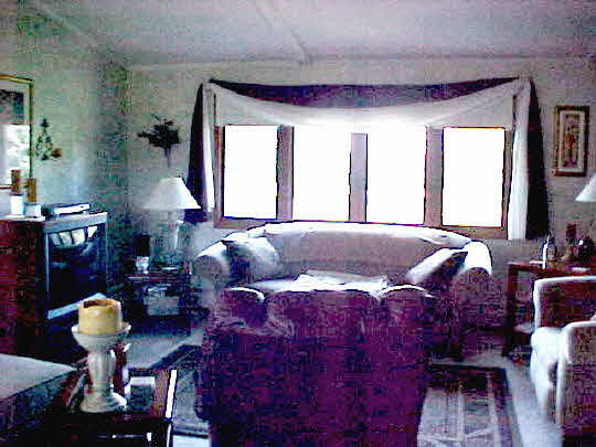5509 North Woodburn Road Byron, IL 61010 - Photo 4 of 8 a bed room with a bed window and table