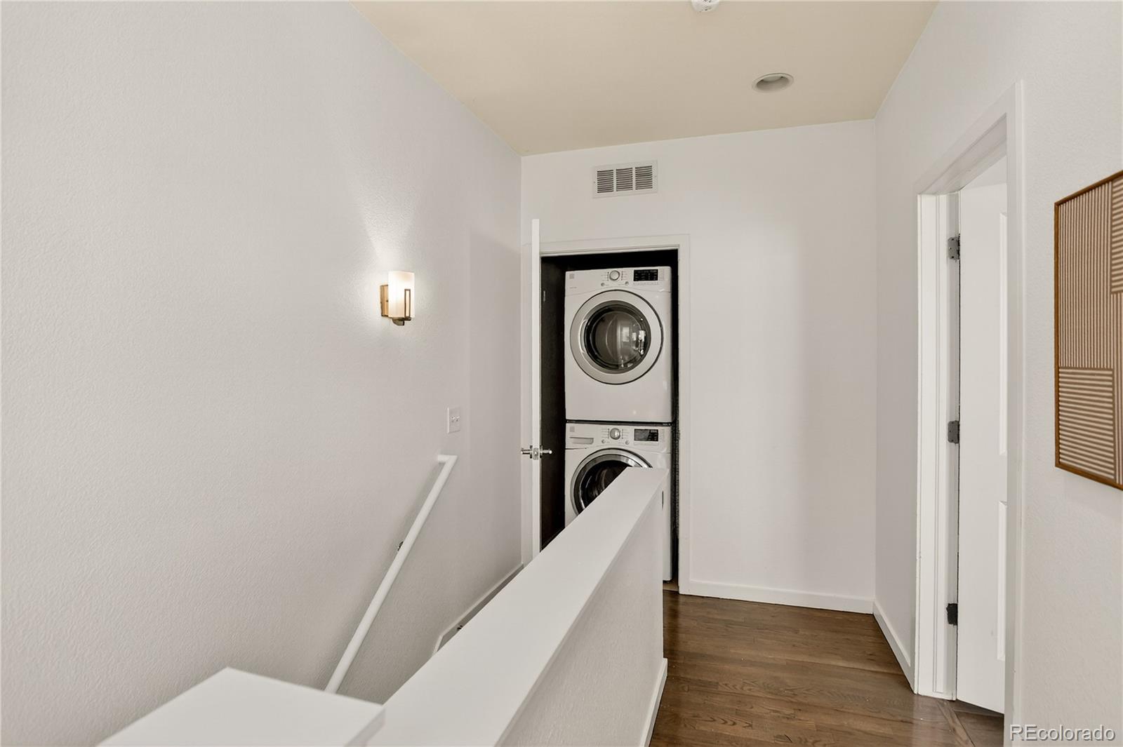 2130 Clay Street Denver, CO 80211 - Photo 19 of 22 a bathroom with a toilet dryer and washer