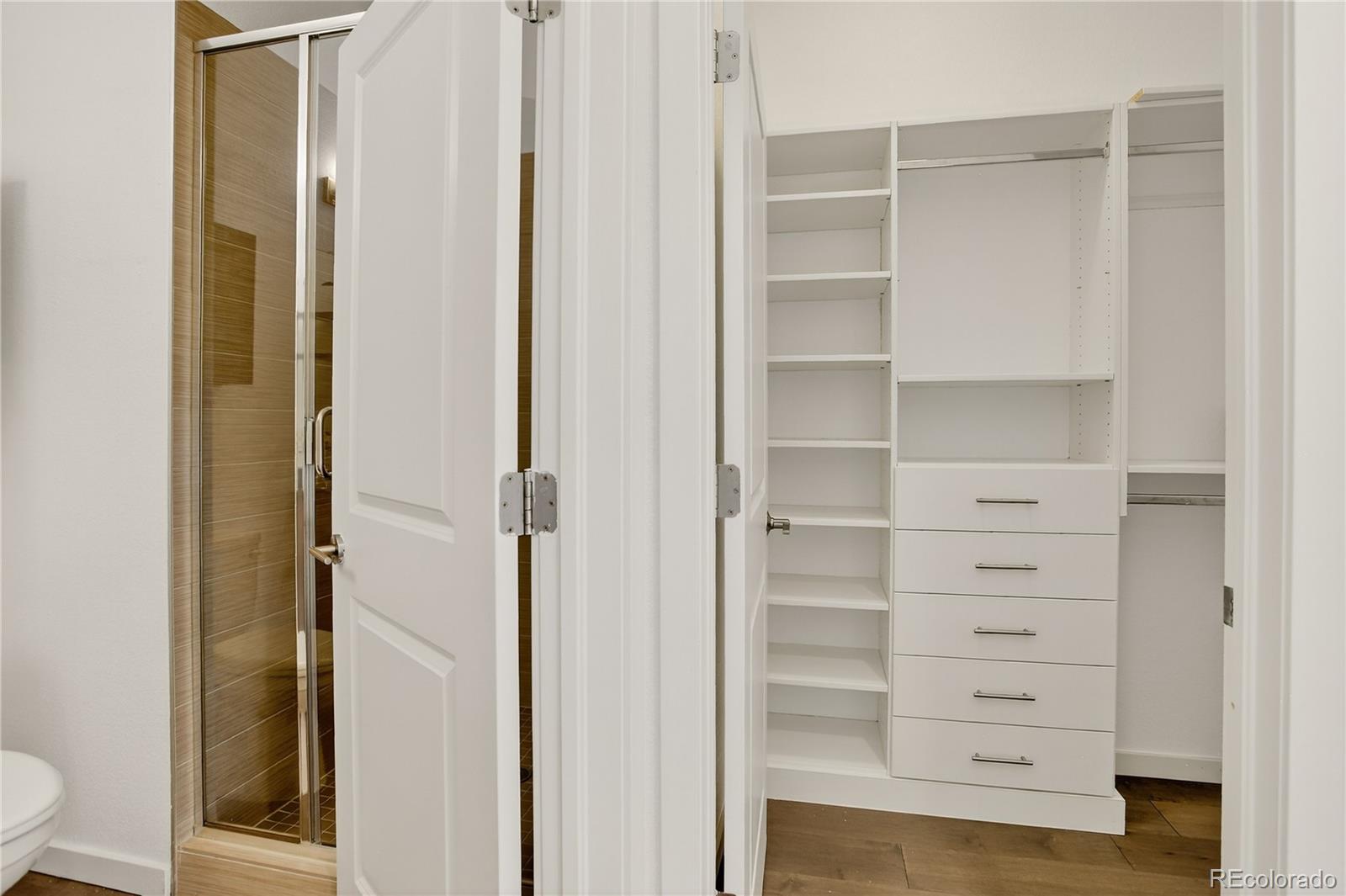 2130 Clay Street Denver, CO 80211 - Photo 4 of 22 a view of walk in closet with empty racks