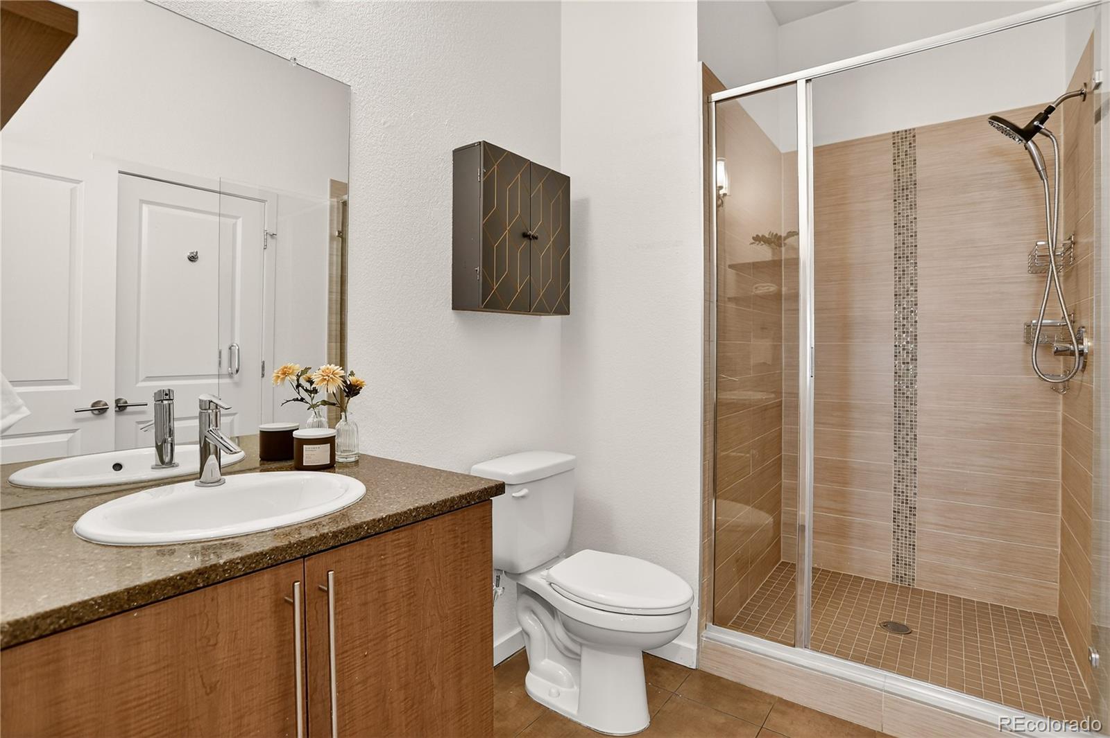 2130 Clay Street Denver, CO 80211 - Photo 5 of 22 a bathroom with a sink toilet and shower