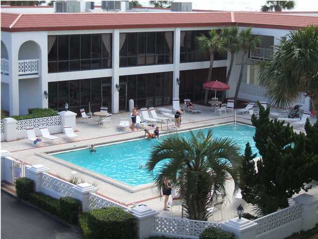 909 Santa Rosa Boulevard, Unit 526 Fort Walton Beach, FL 32548 - Photo 7 of 8 a view of a house with backyard sitting area and swimming pool