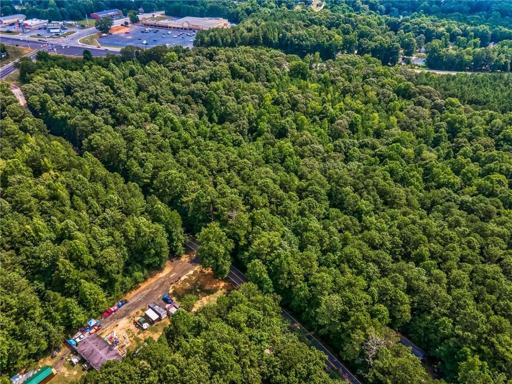 0 Borrow Pit Road Douglasville, GA 30134 - Photo 10 of 10 a view of a garden with plants and a bench