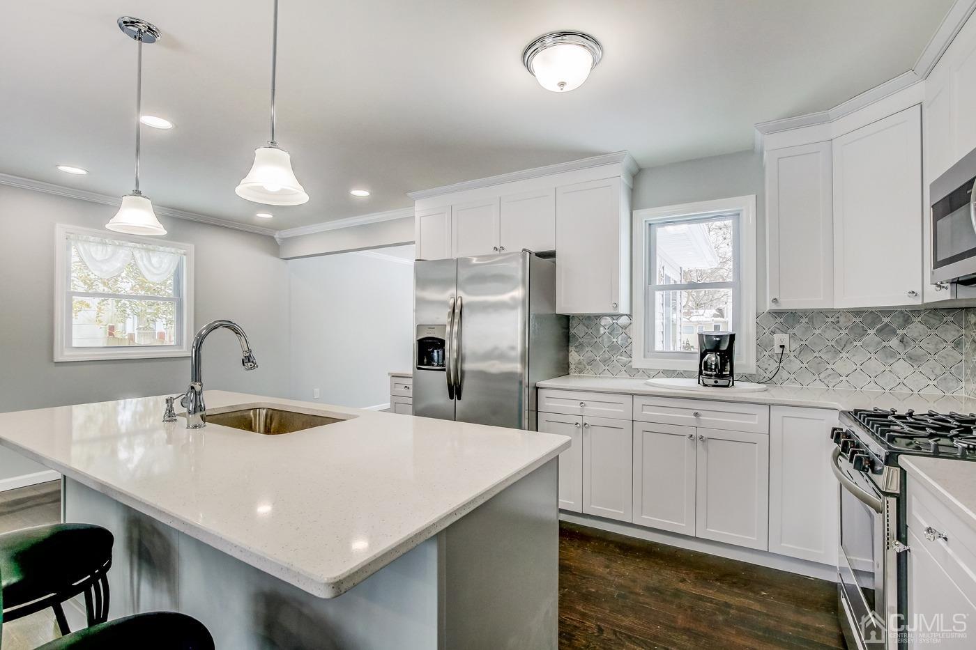 59 Stony Road Edison, NJ 08817 - Photo 13 of 27 a kitchen with sink stove and refrigerator