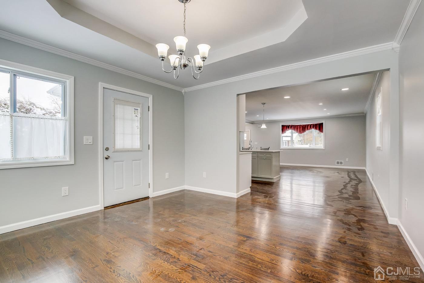 59 Stony Road Edison, NJ 08817 - Photo 15 of 27 a view of an empty room with wooden floor and a window