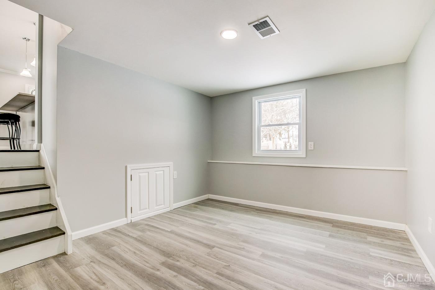 59 Stony Road Edison, NJ 08817 - Photo 16 of 27 wooden floor in an empty room with a window