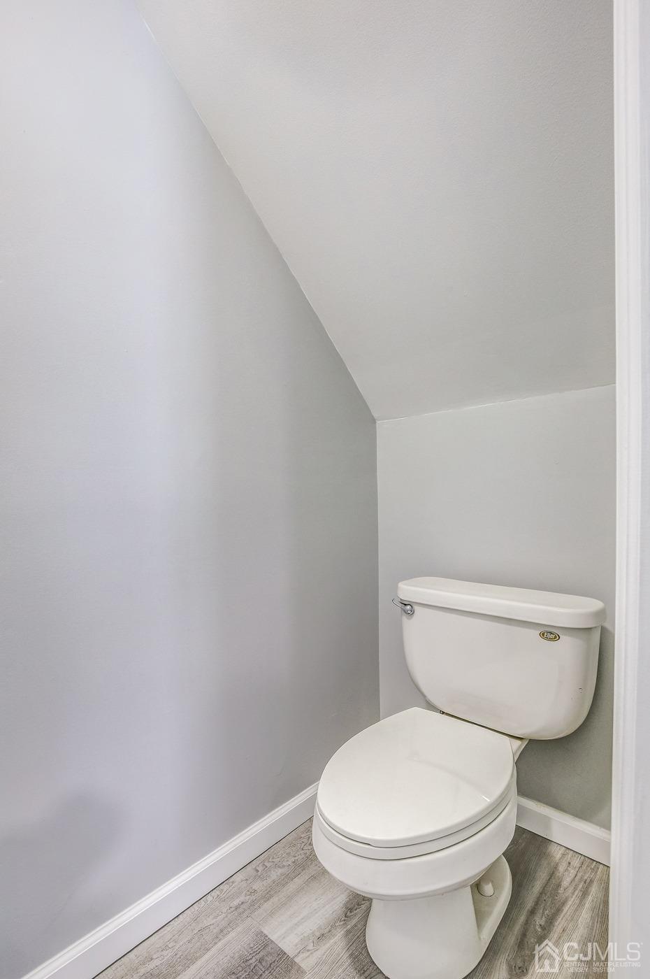 59 Stony Road Edison, NJ 08817 - Photo 17 of 27 a white toilet sitting next to a shower